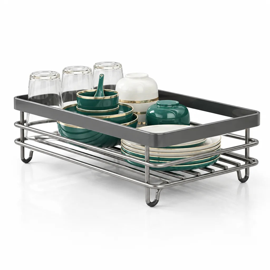 A black dish drying rack with a dark grey tray rim and stainless steel wire frame, holding three upturned clear glasses, stacked teal and gold-rimmed bowls, white and teal lidded pots, and a row of matching plates standing on edge, shown against a white background.