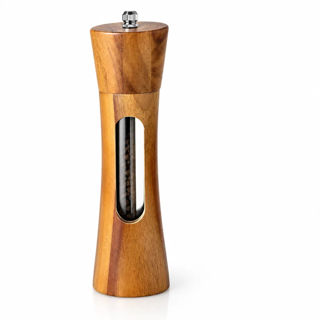 A single wooden salt and pepper grinder with an hourglass-shaped body, a tapered top and a small metal adjustment knob, standing against a plain white background with peppercorns visible through the clear oval window on the front.