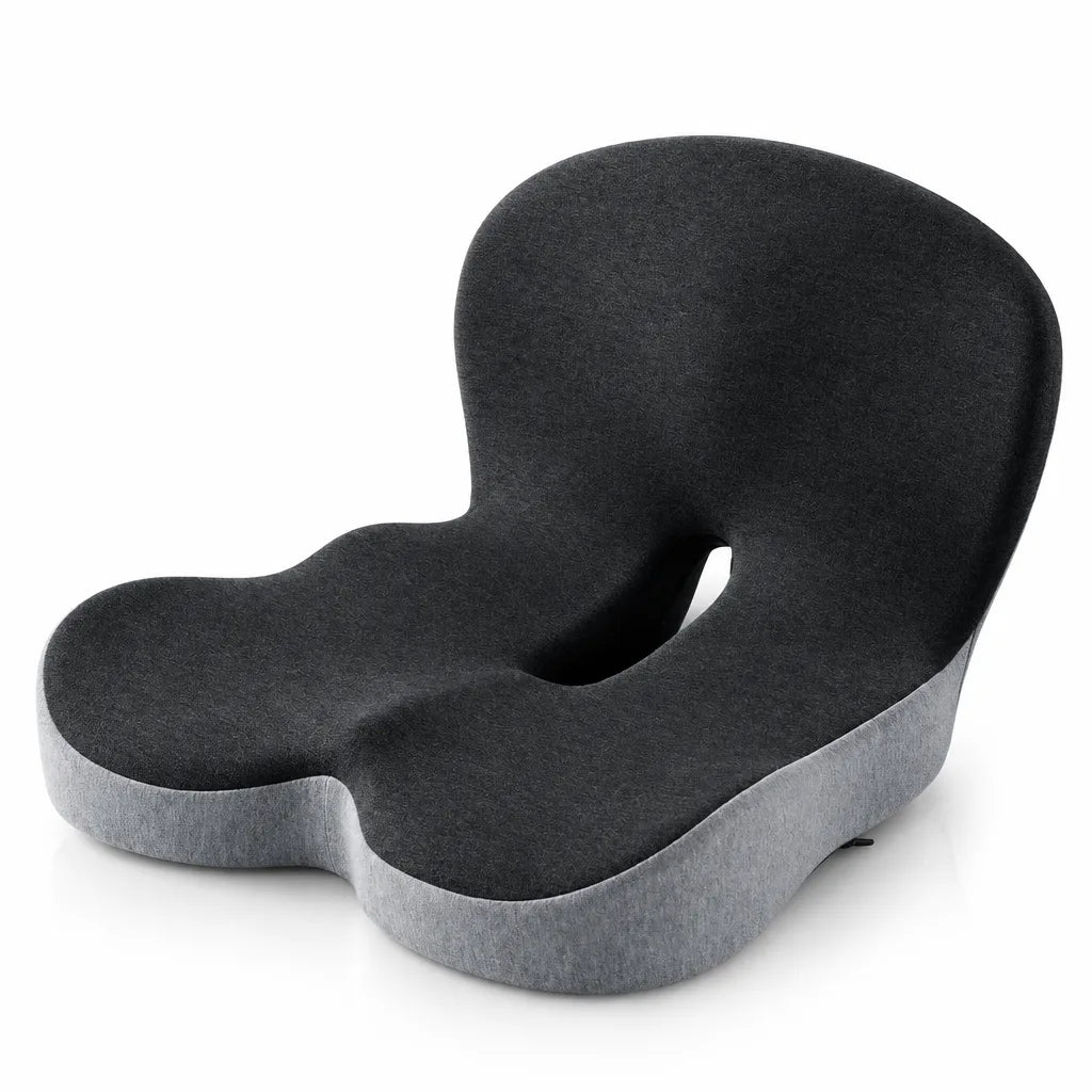 Dark gray memory foam seat cushion with a contoured backrest, scooped sides and a cut-out coccyx channel, shown at an angle on a white background with a lighter gray base visible underneath.