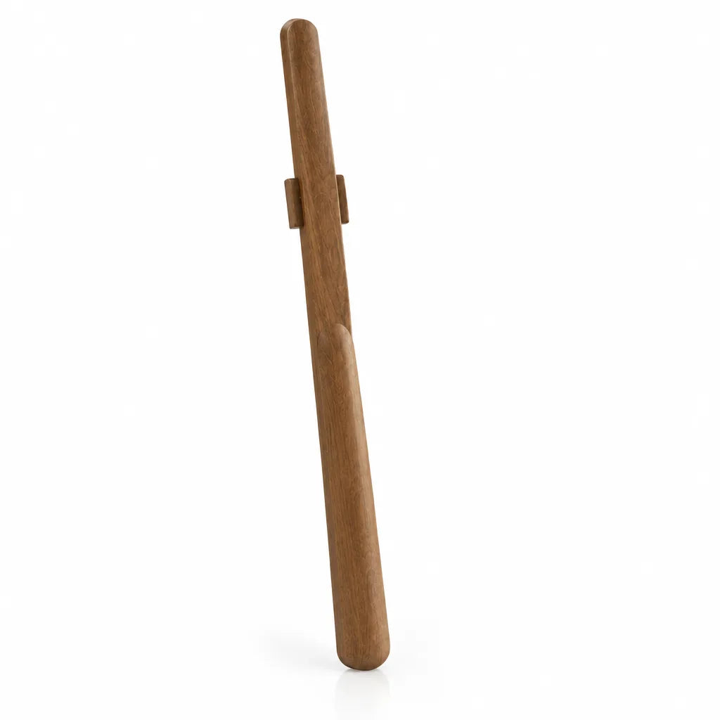 Extra-long walnut shoehorn standing upright against a plain white background, its slim curved body tapering to a rounded scoop and fitted with a small bracket near the top for magnetic wall storage.