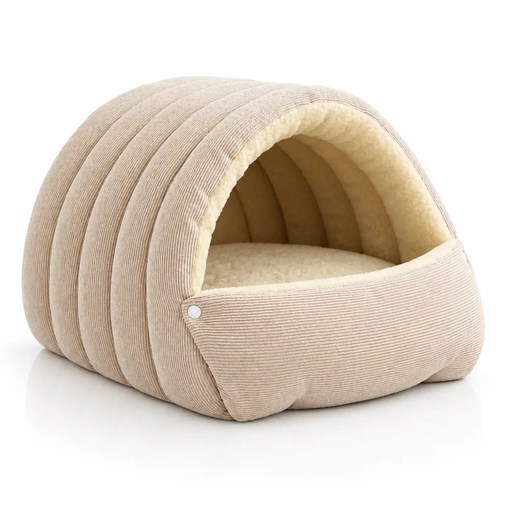 Cream corduroy 2-in-1 cat and small dog cave bed with an arched dome roof, lined in soft ivory fleece, shown from the front at a slight angle with a snap fastener on the folded-down side panel.