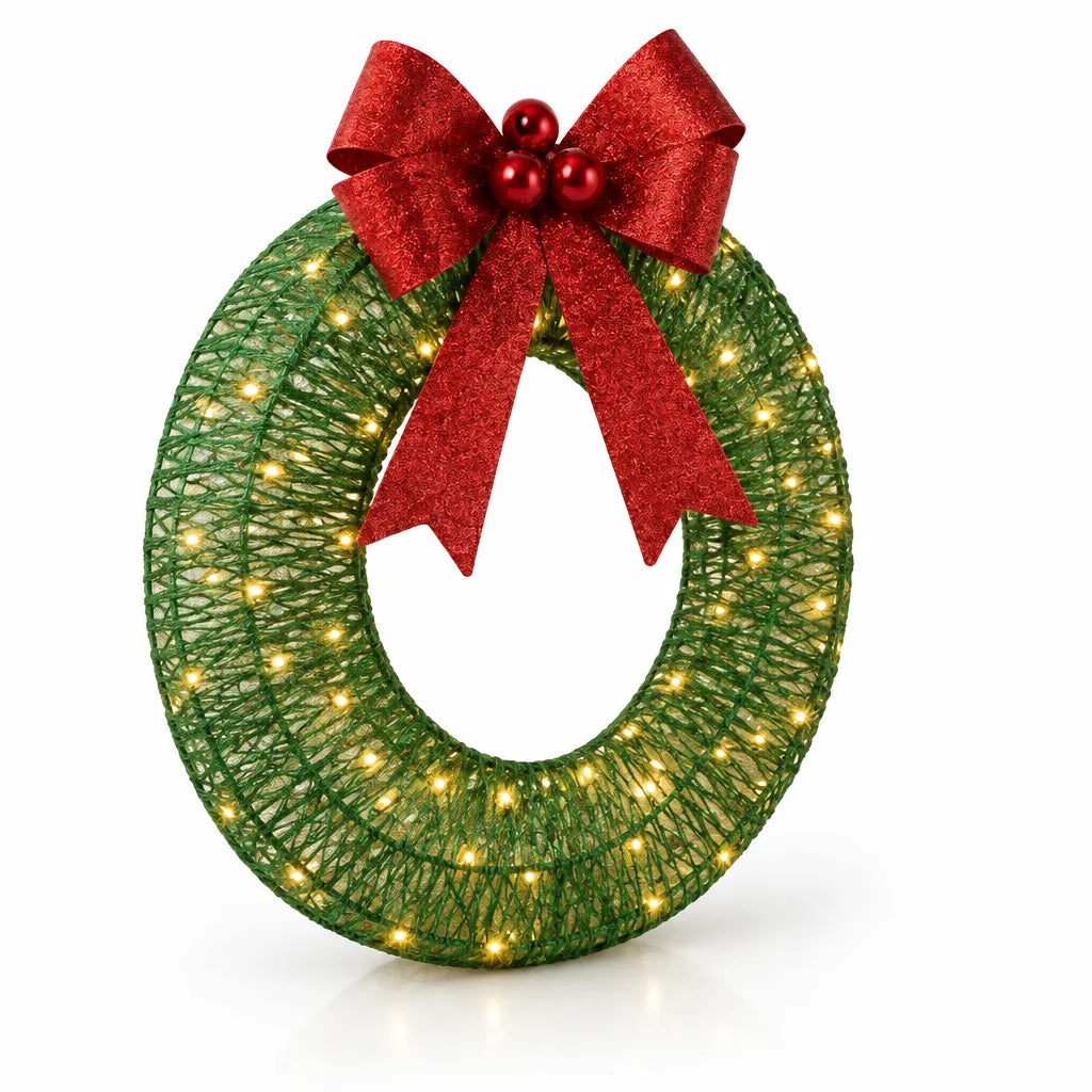 A 40 cm green string-wrapped LED Christmas wreath lit with warm white lights, topped with a glittery red bow and a cluster of red berries, standing upright against a white background.