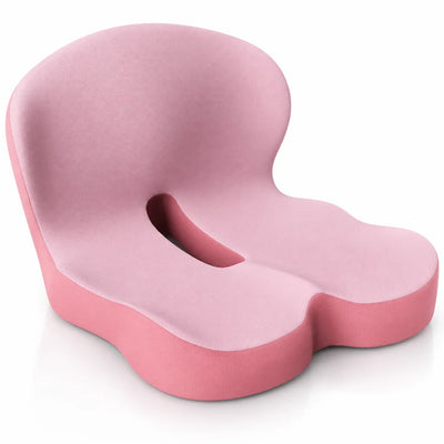 Pink memory foam seat cushion with a contoured backrest, cut-out opening in the middle and a darker pink base, shown at an angle against a white background.