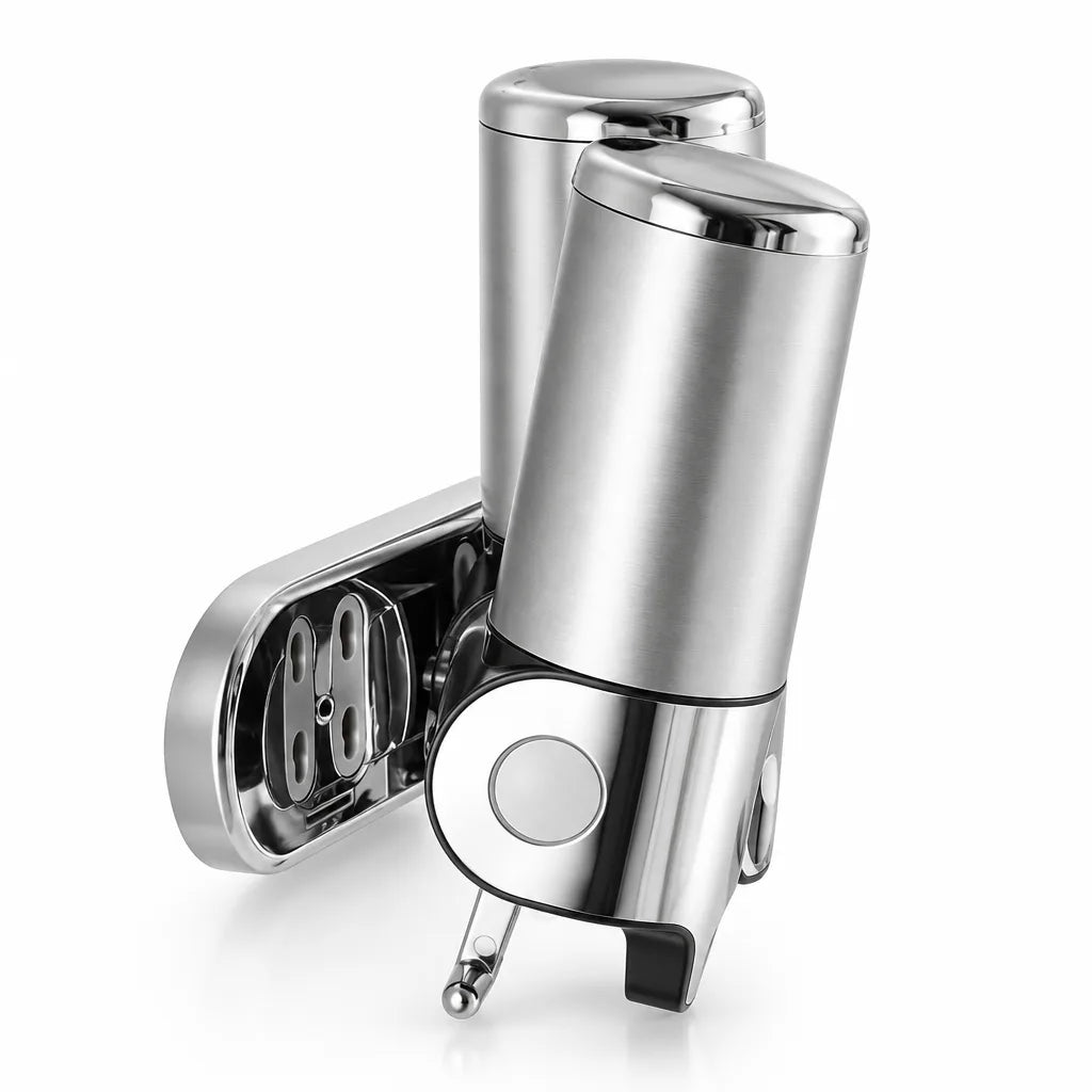 Silver stainless steel wall-mounted soap dispenser shown at an angle against a white background, with its chrome push button and spout at the front and the open mounting bracket visible behind the cylindrical body.