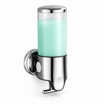 Wall-mounted soap dispenser with a polished chrome base and pump lever, its clear transparent cylinder filled with pale mint-green liquid soap, shown against a plain white background.