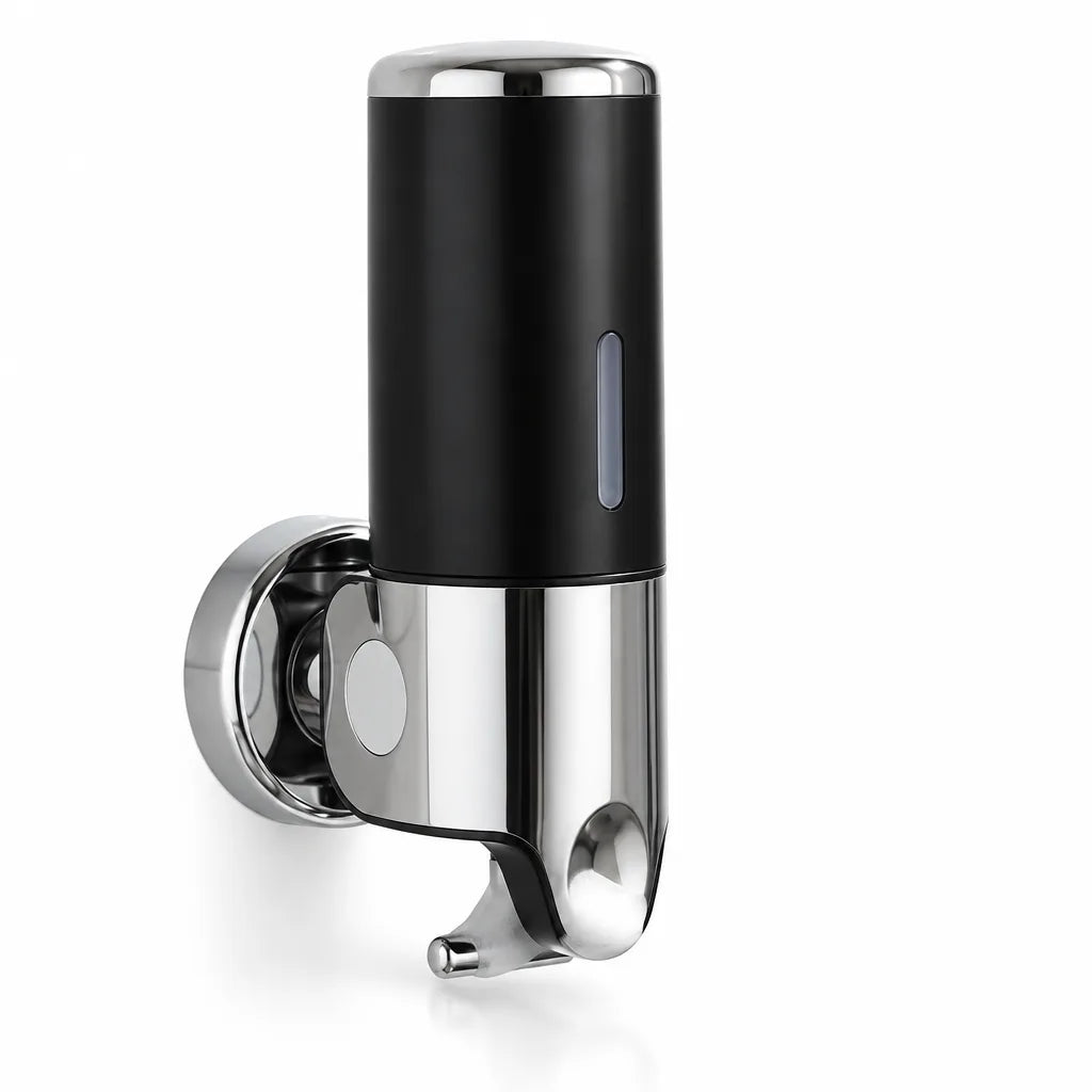 Black and chrome wall-mounted soap dispenser with a round mounting plate, a narrow level window on the cylinder and a push lever underneath, shown against a plain white background.
