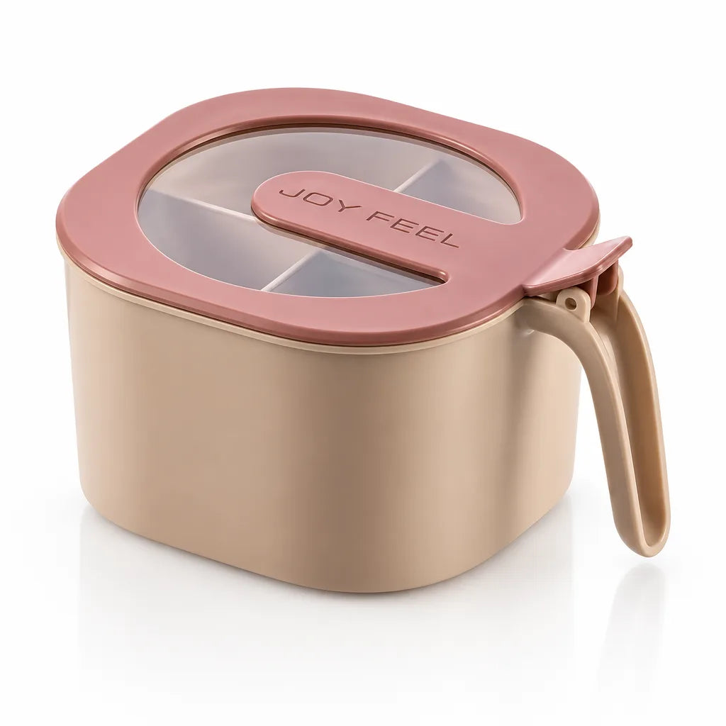 Beige spice storage jar with a pink hinged lid and a clear window showing the divided compartments inside, with a built-in spoon slotted into the lid and a curved side handle.