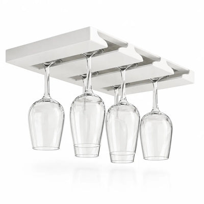 A white under-cabinet wine glass rack with three slots, shown against a plain white background with four clear stemmed glasses hanging upside down from its rails.
