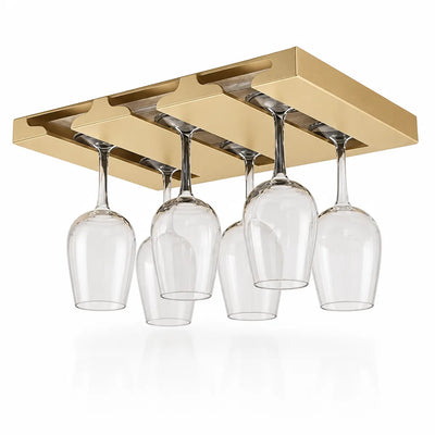 Gold-toned under-cabinet wine glass rack with three slots, holding six clear stemmed glasses upside down against a white background.